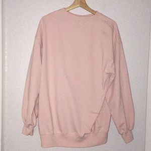 pastel pink sweatshirt